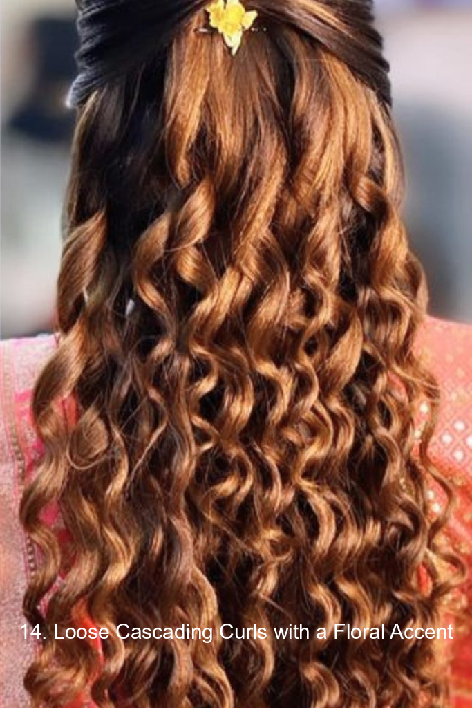 14. Loose Cascading Curls with a Floral Accent