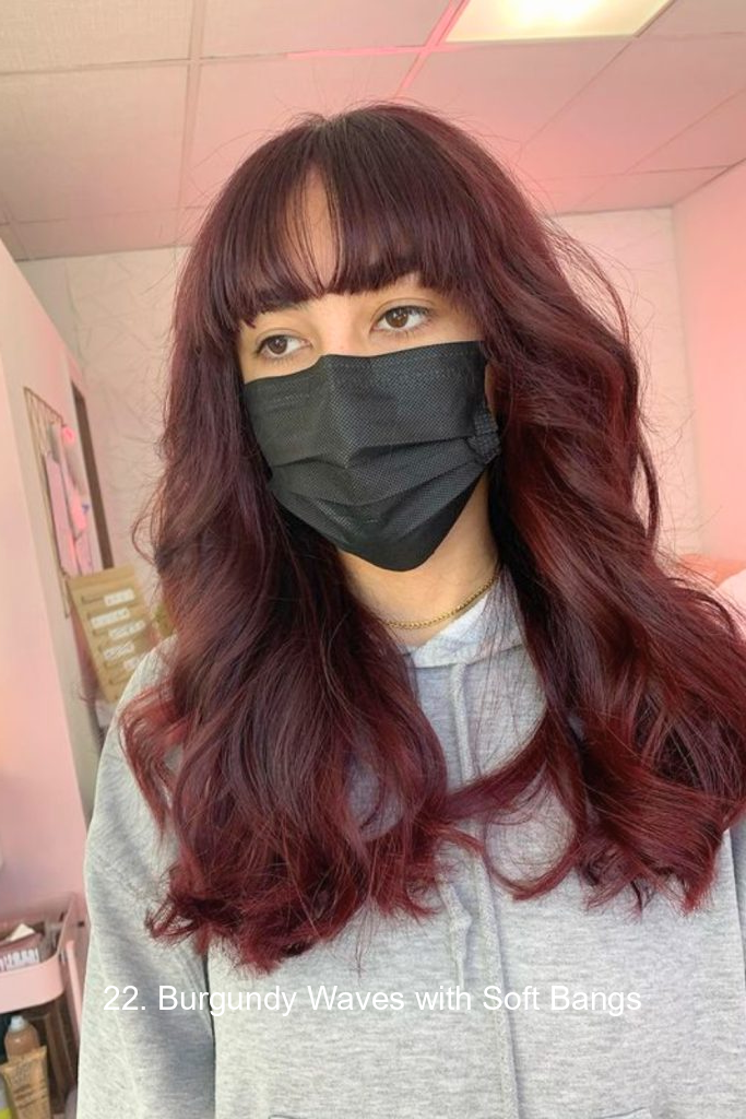 22. Burgundy Waves with Soft Bangs